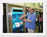 DSCN0155 * a tourist putting his money in the machine to purchase a subway ticket (the train, not the sandwich...) * 2592 x 1944 * (1015KB)