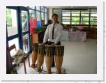 DSCN0190 * a set of drums and a university student who demonstrated many of the instruments. Here he is playing Glawng Khaek -- they are usually in sets of two, the high sounding one refered to as male, and the low sounding one refered to as female. * 2592 x 1944 * (1.04MB)