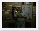 DSCN0311 * a tourist playing a sousaphone shaped French horn object * 2592 x 1944 * (1.05MB)