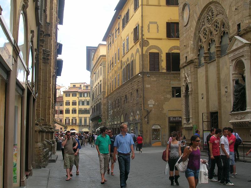 DSCN1697.JPG - Florence is an interesting mix of medieval and modern. It's not at all unusual for something like the very early architecture in the middle of the picture to be surrounded by more modern architecture both next to it and above it.